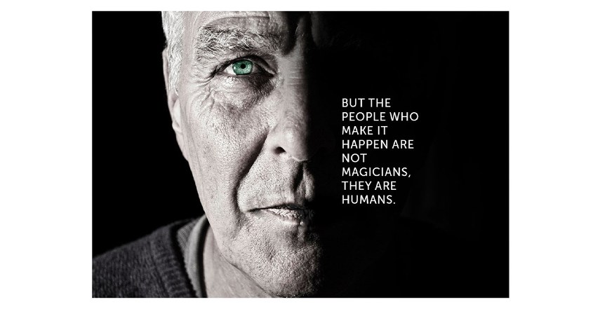 Block with half of an older man's face lit from the left and a short column of text in the dark half on the right